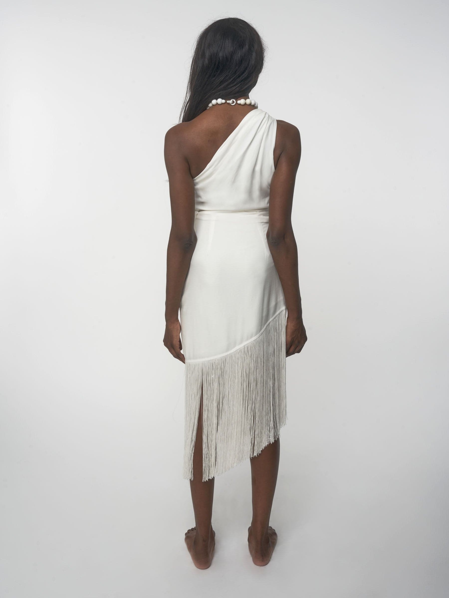 White sustainable Tencel one shoulder dress with fringe
